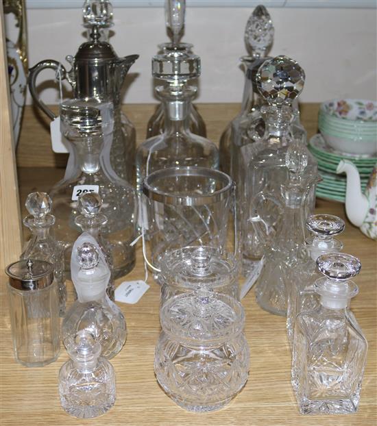 Seven decanters and stoppers, various, one with plated mount, a plate mounted claret jug and sundry cut glass bottles, etc,